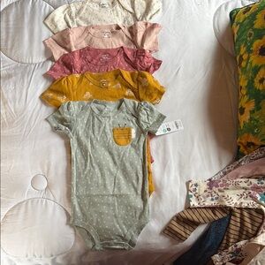 NEW, Carter’s onesie bundle 5 in set. Assorted Colors.